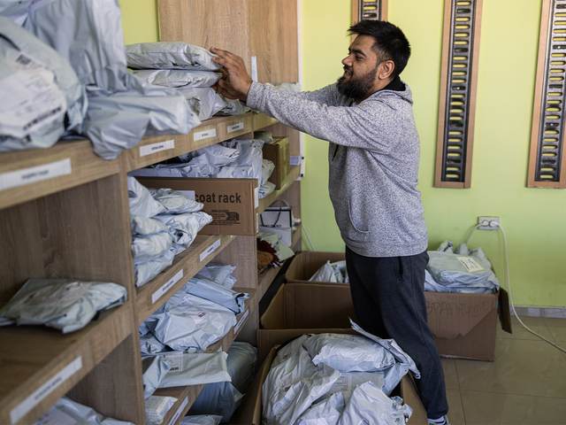 Erdzan Shakirovski works in his cargo delivery store in Shuto Orizari in Skopje, North Macedonia. Photo: Akos Stiller